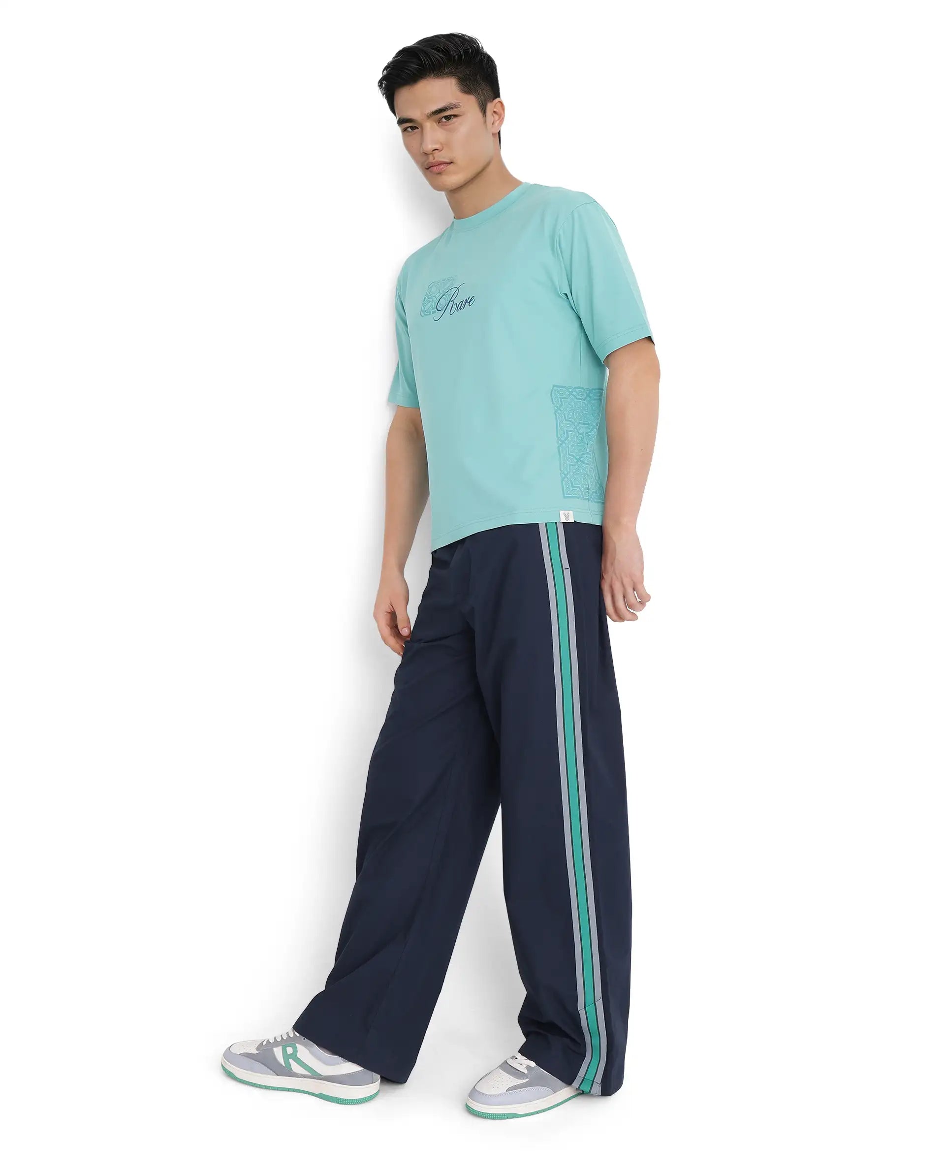 Shop the latest men's clothing trends at a fraction of the price.  Rare Rabbit Men Newnon Navy Cotton Fabric Plain Track Pant